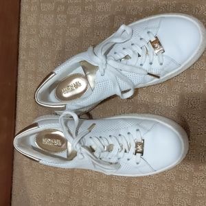 Michael Kors white sneakers with gold colored embellishment
